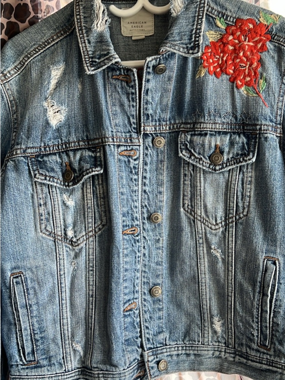 American Eagle Outfitters Light Wash Denim Jacket with Red Embroidery